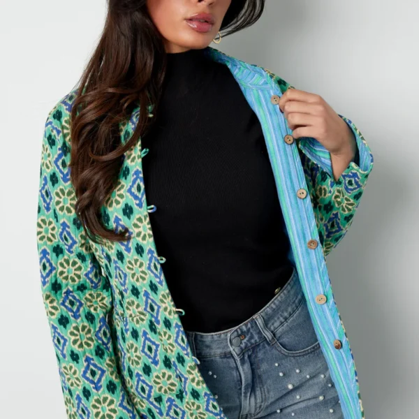 Blauw groen jasje met geometrische print Dubbelzijdig jasje met geometrisch patroon