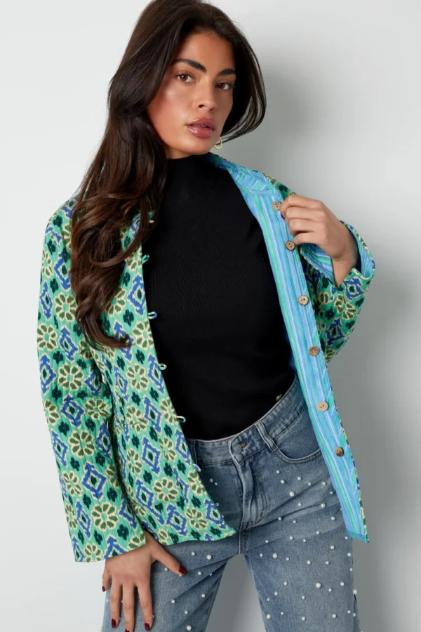 Blauw groen jasje met geometrische print Dubbelzijdig jasje met geometrisch patroon